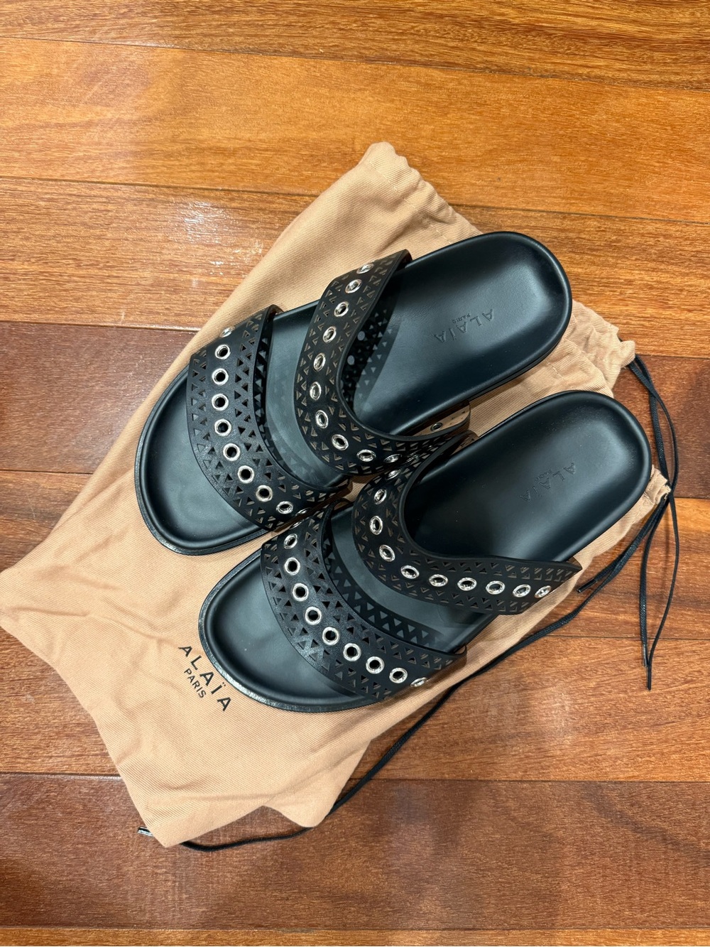 Alaia Black Eyelet Perforated Leather Slides